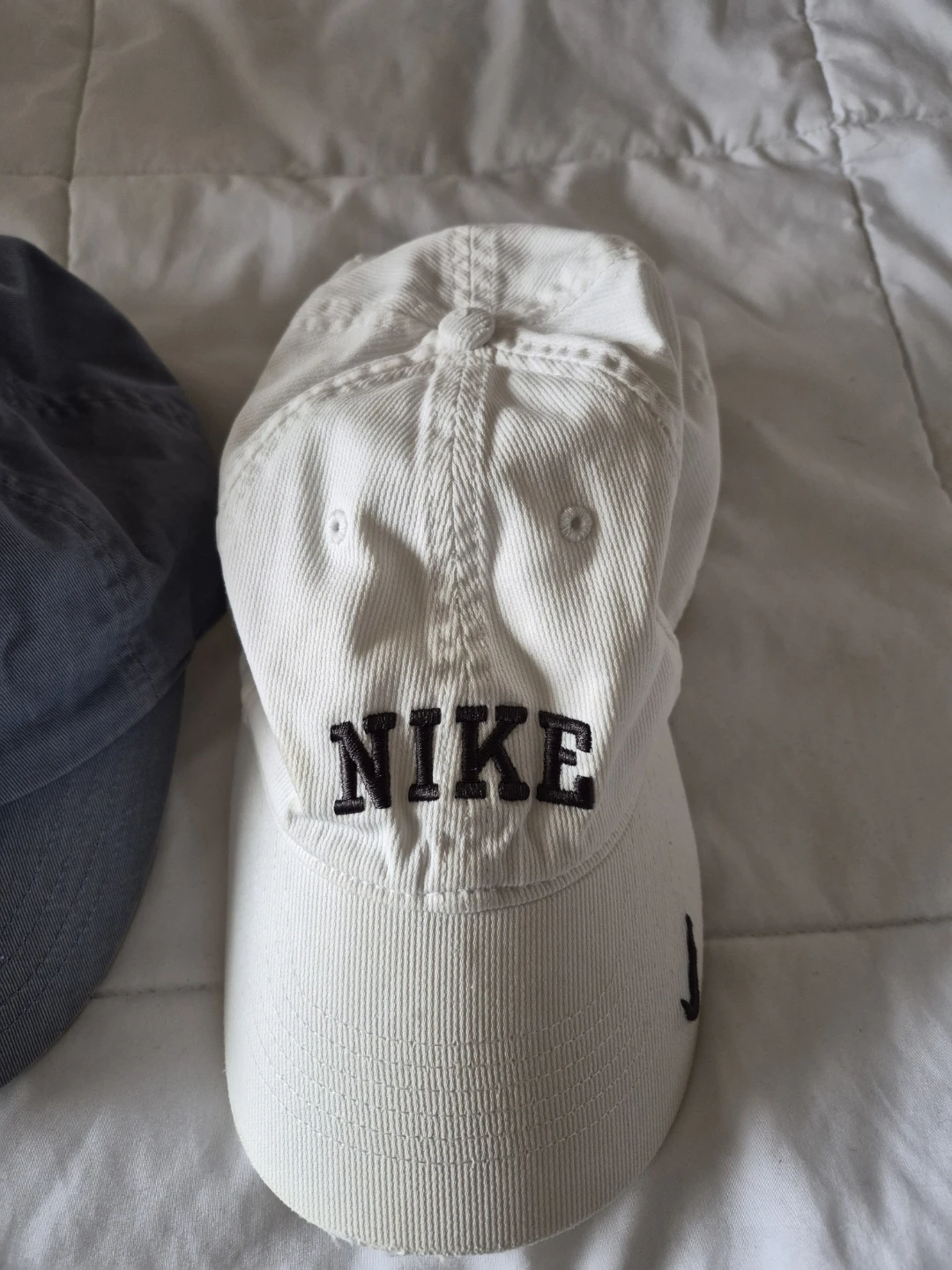 White Nike Baseball Cap & Light Blue Old Navy Baseball Cap