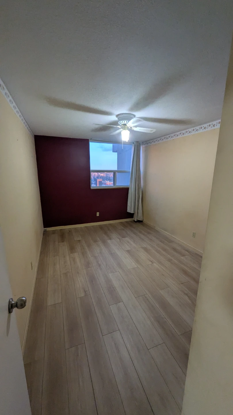 Bedroom with hardwood floors and closet - photo 2