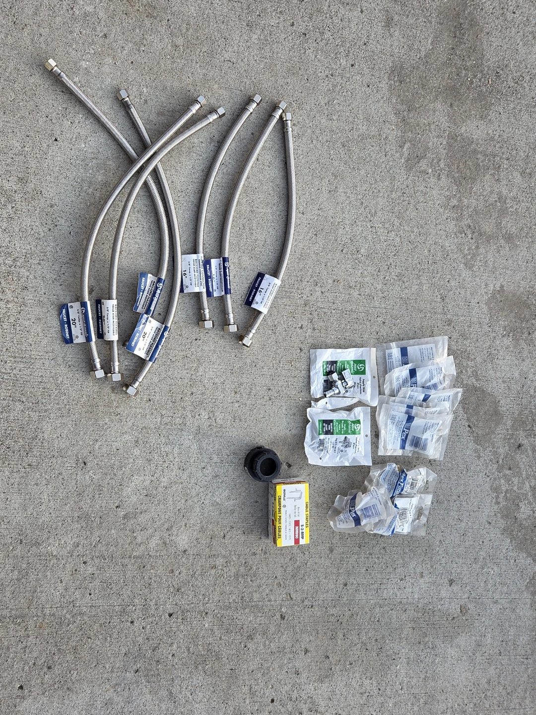 Assorted Plumbing PEX Fittings and Flexible Hoses