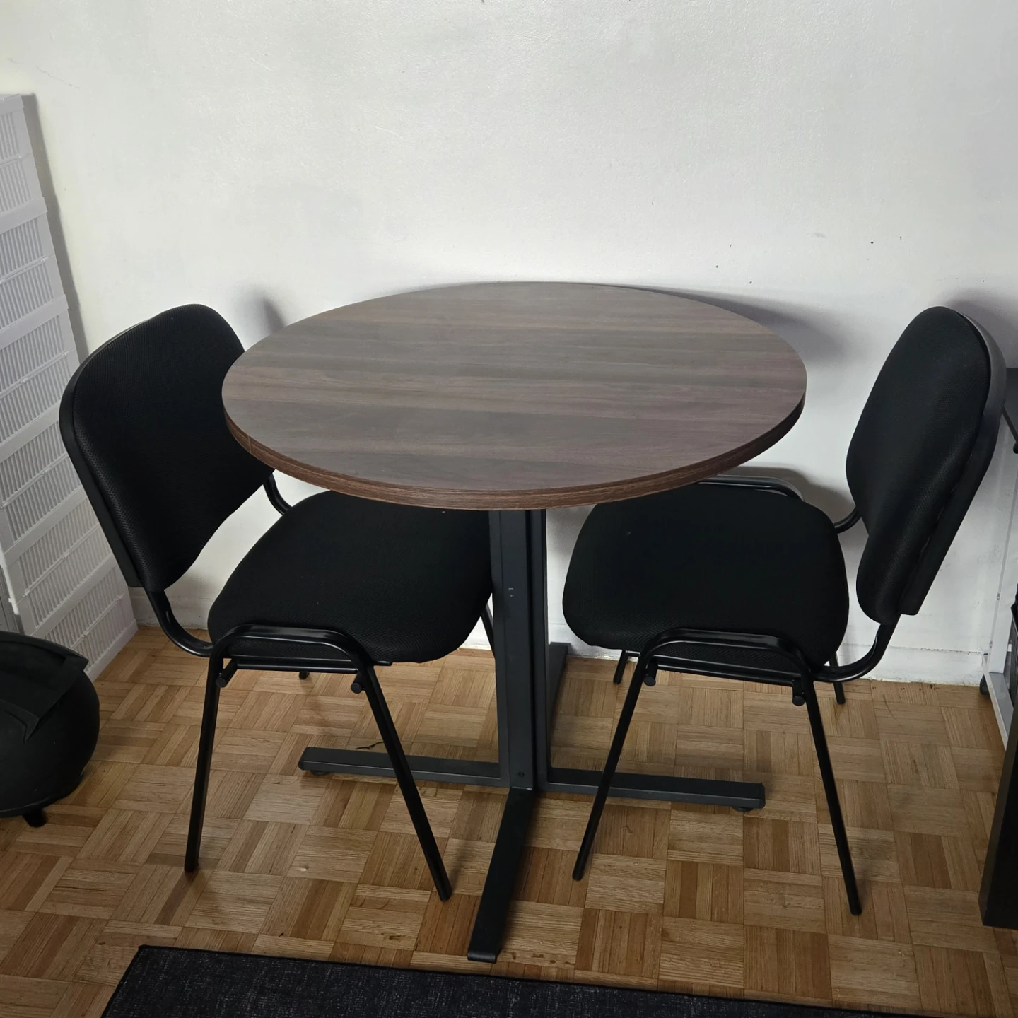 Dinning table and two chairs .