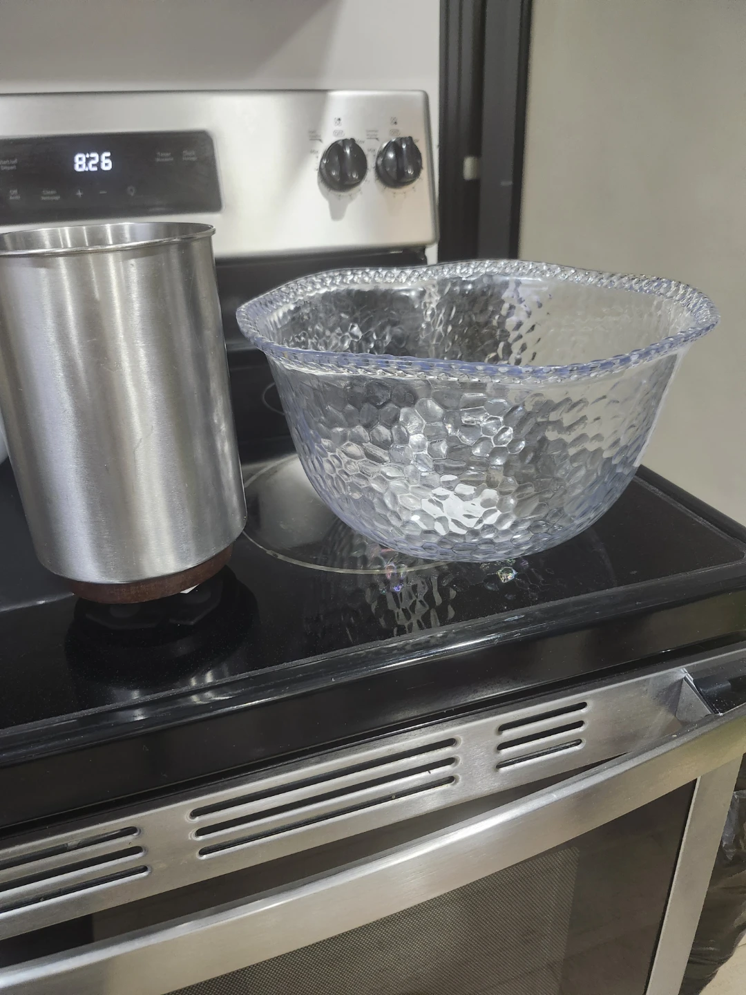 Clear textured serving bowl and stainless steel cup