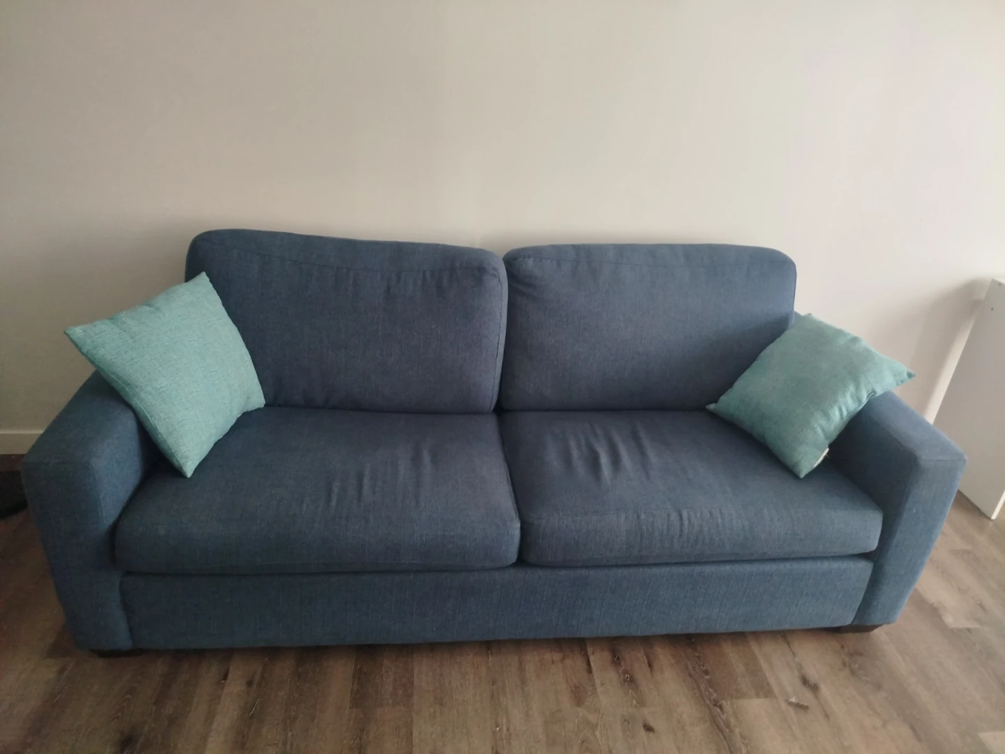 Blue Sofa with 2 Throw Pillows