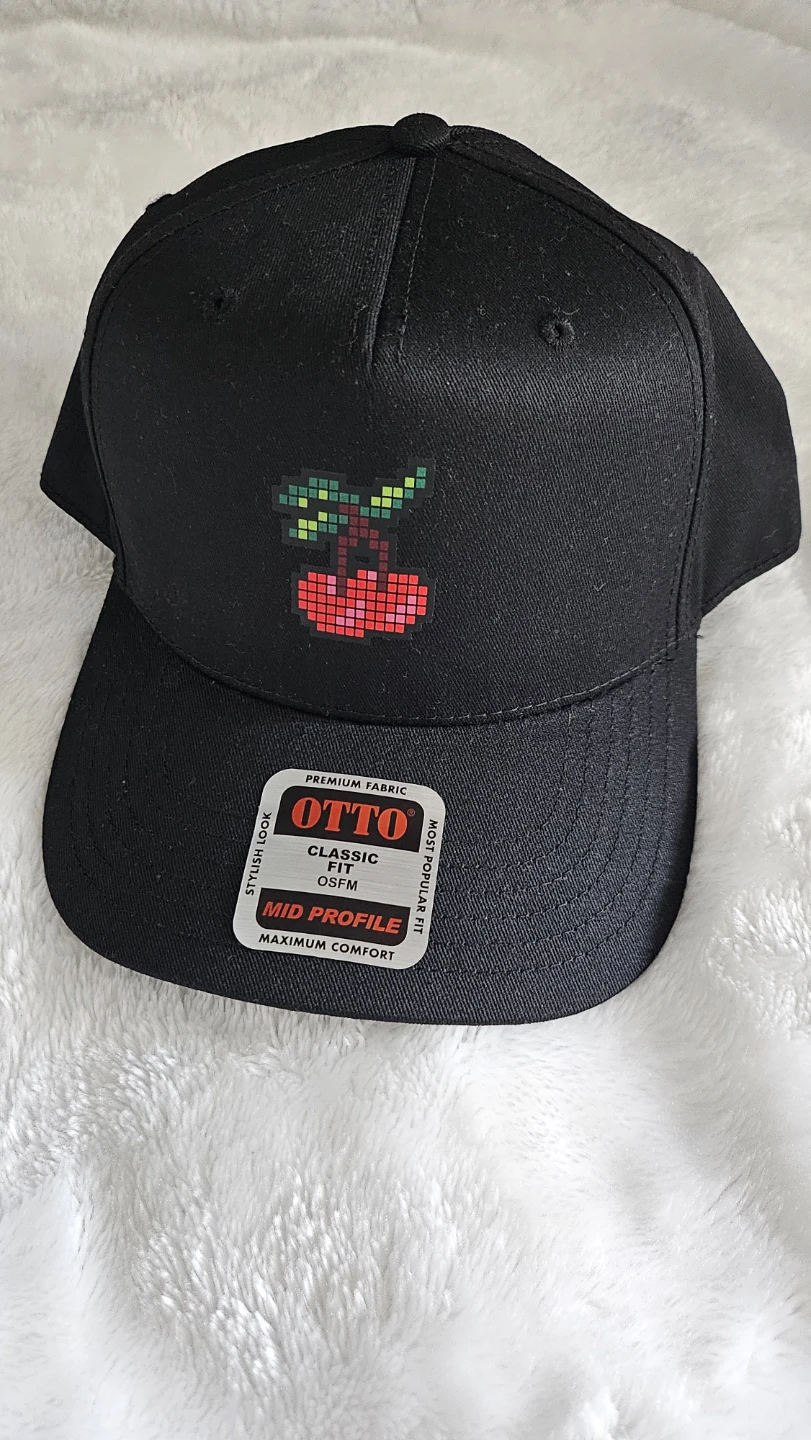 Black OTTO Cap with Pixelated Cherry Design ⚽
