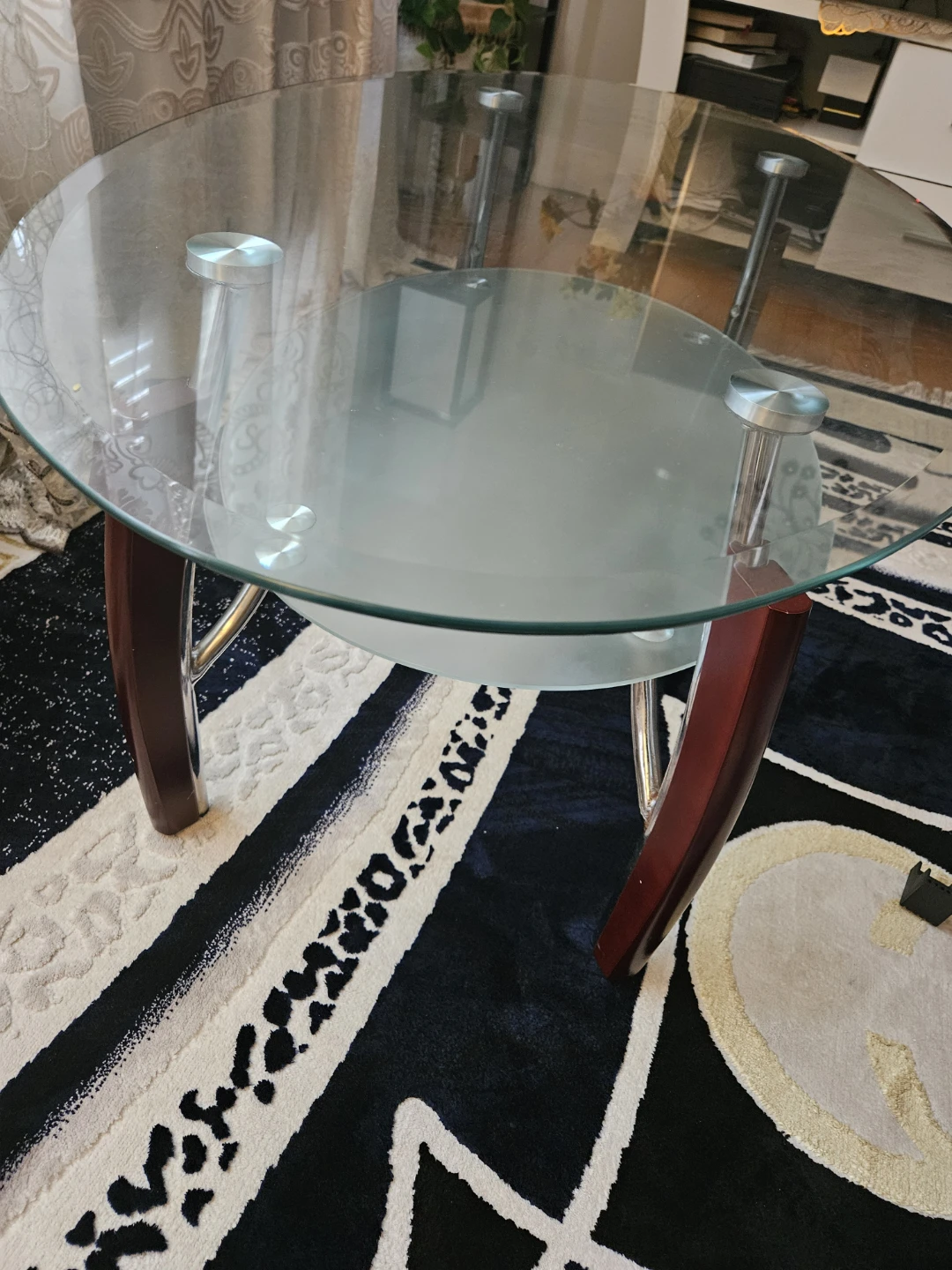 Oval Glass Coffee Table with Wooden Accents
