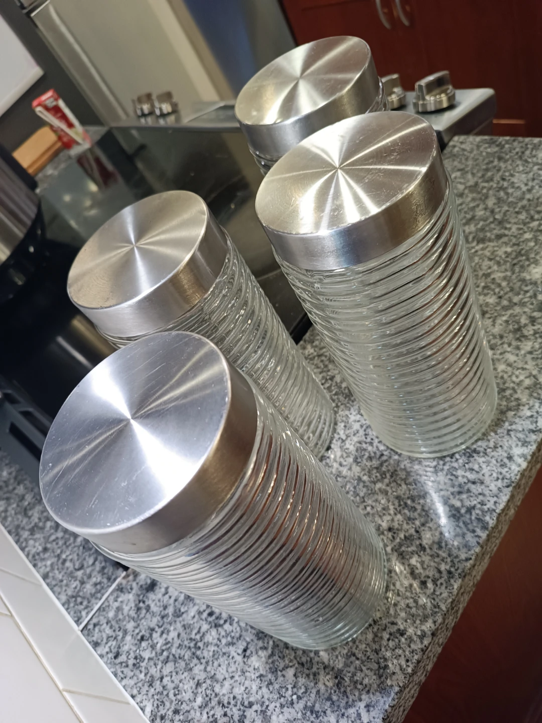 Set of 4 Clear Glass Canisters with Silver Lids