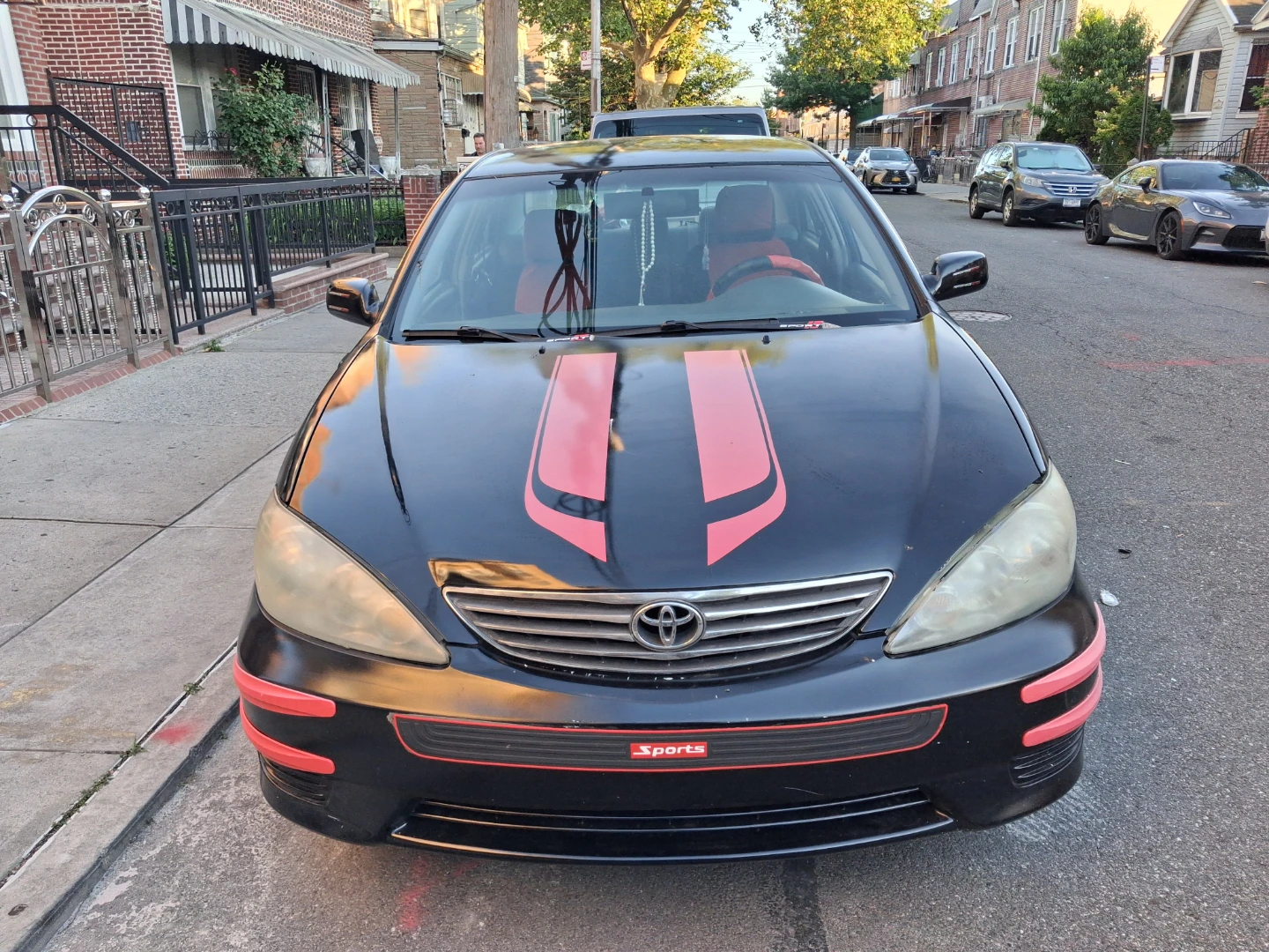 Black Toyota Camry with Red Accents