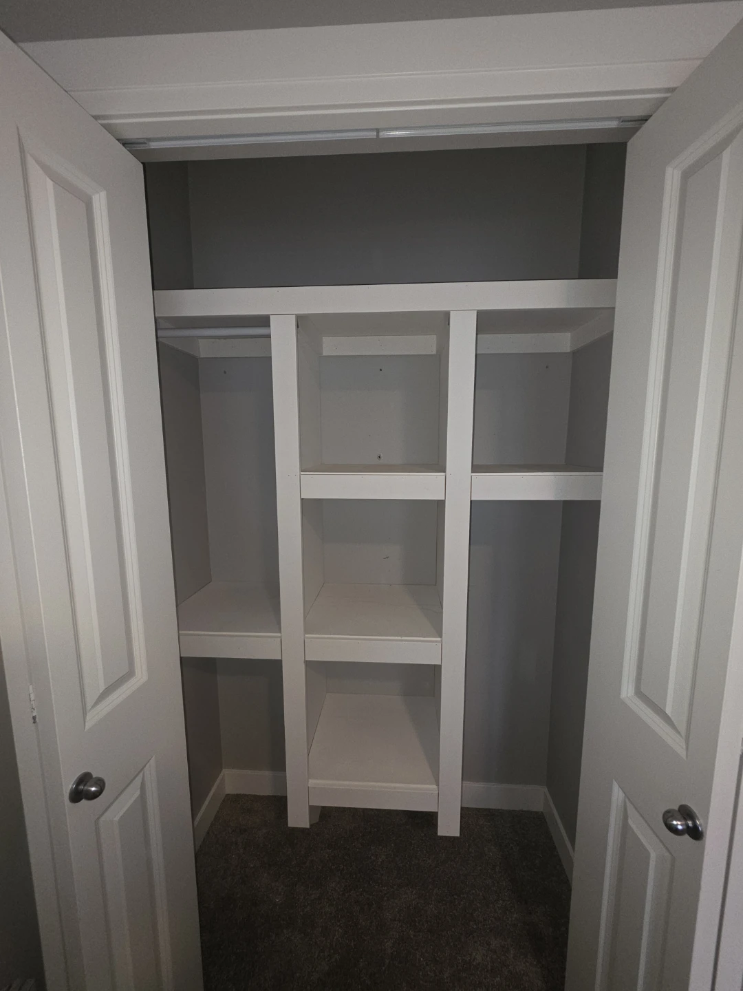 White Closet Shelving with hanging rods