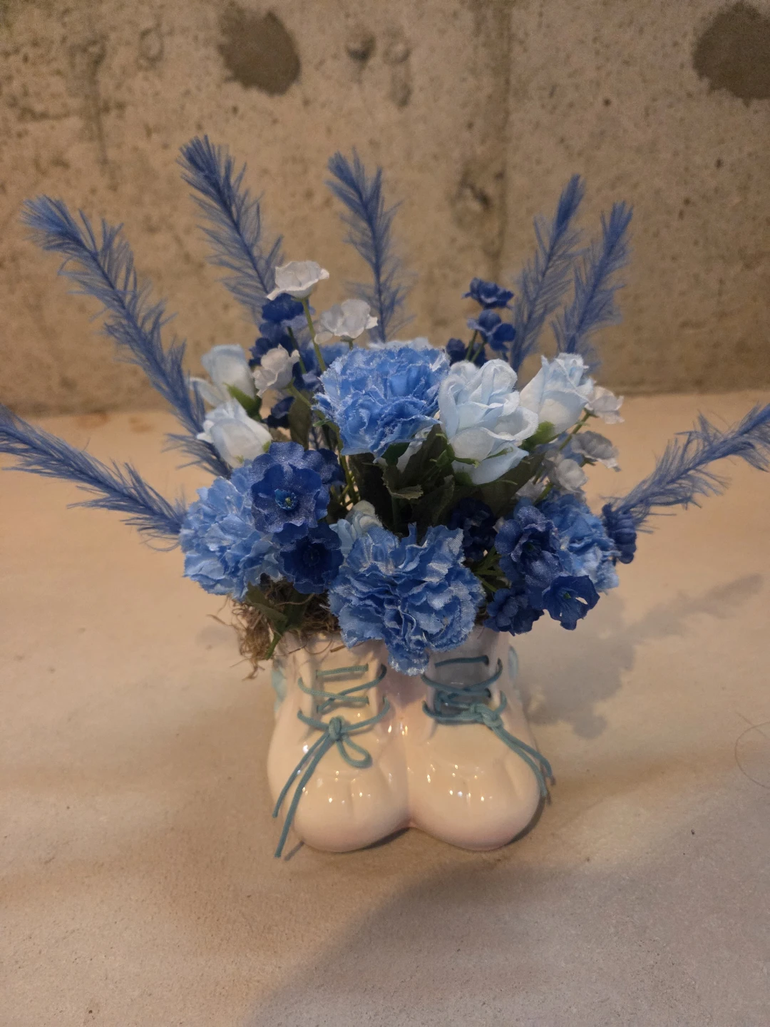Blue Floral Arrangement in Baby Bootie Vase