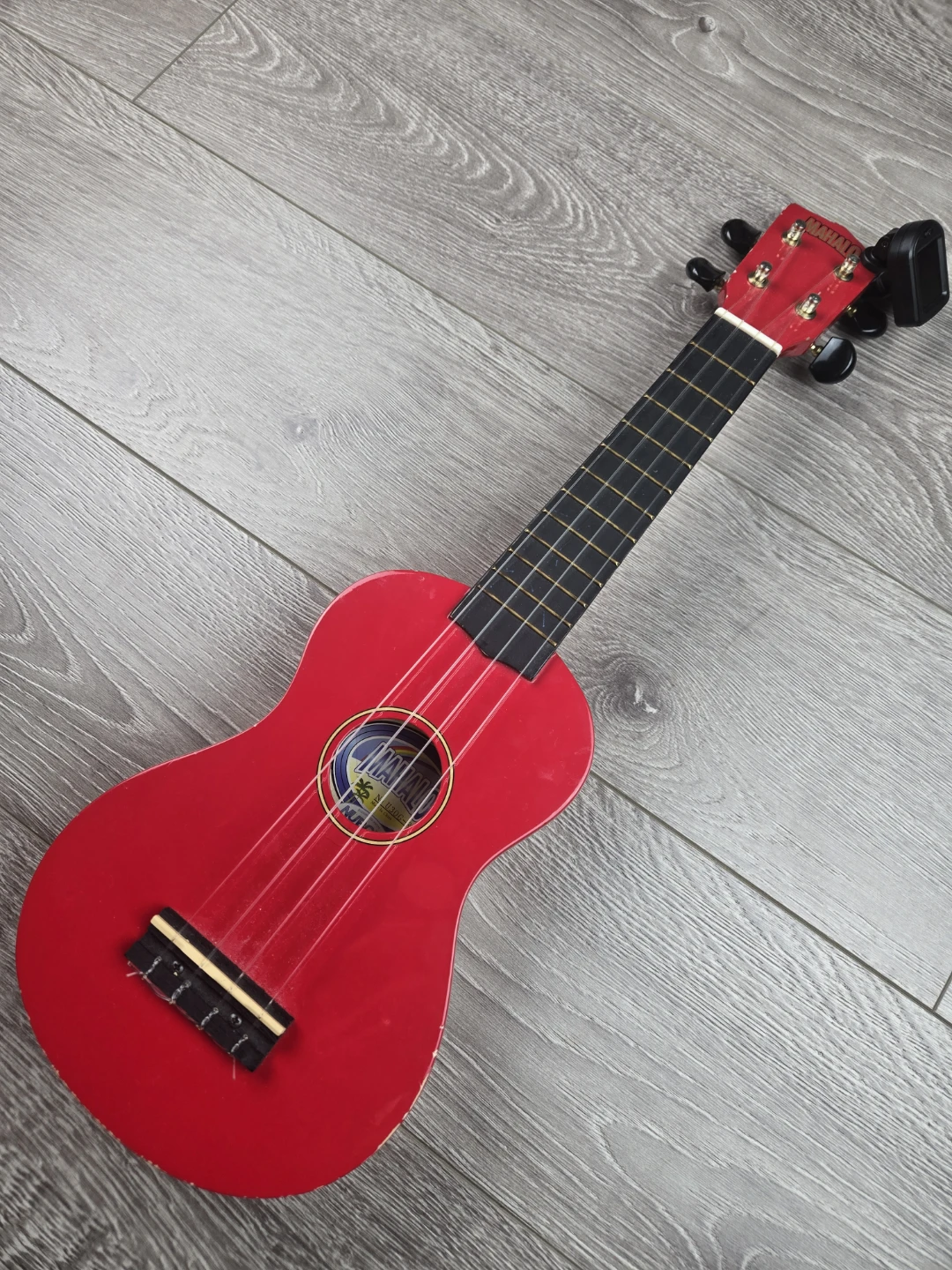 Red real wood ukelele with tuner