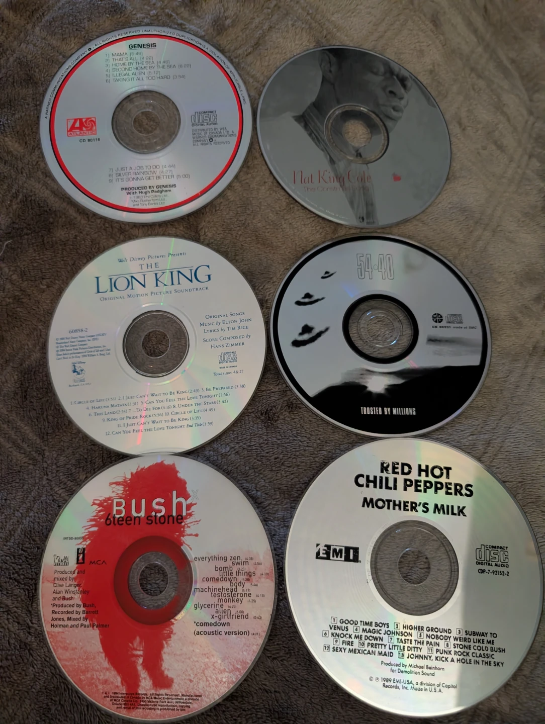 6 CDs: Genesis, NKC, Lion King, 54-40, Bush, RHCP