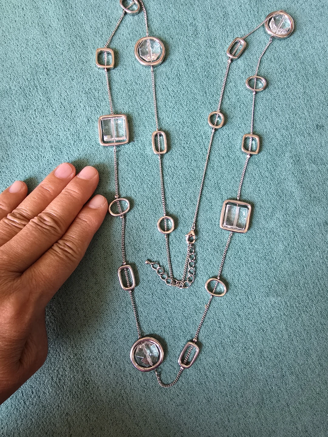 Silver tone necklace with clear geometric pendants