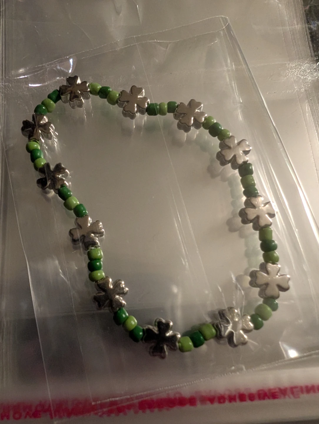 Green Beaded Bracelet with Clover Charms