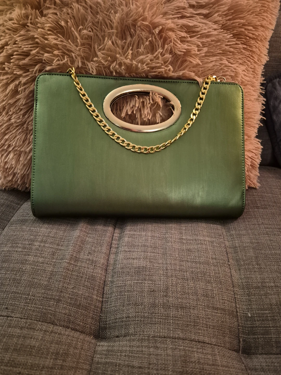 Metallic green clutch with gold chain and handle
