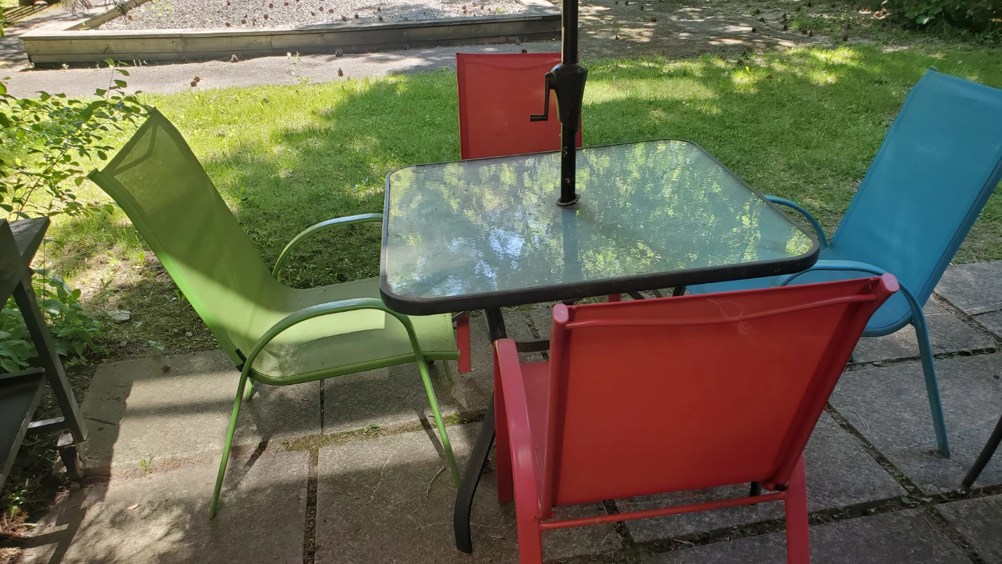 Red Patio Umbrella and table with chairs