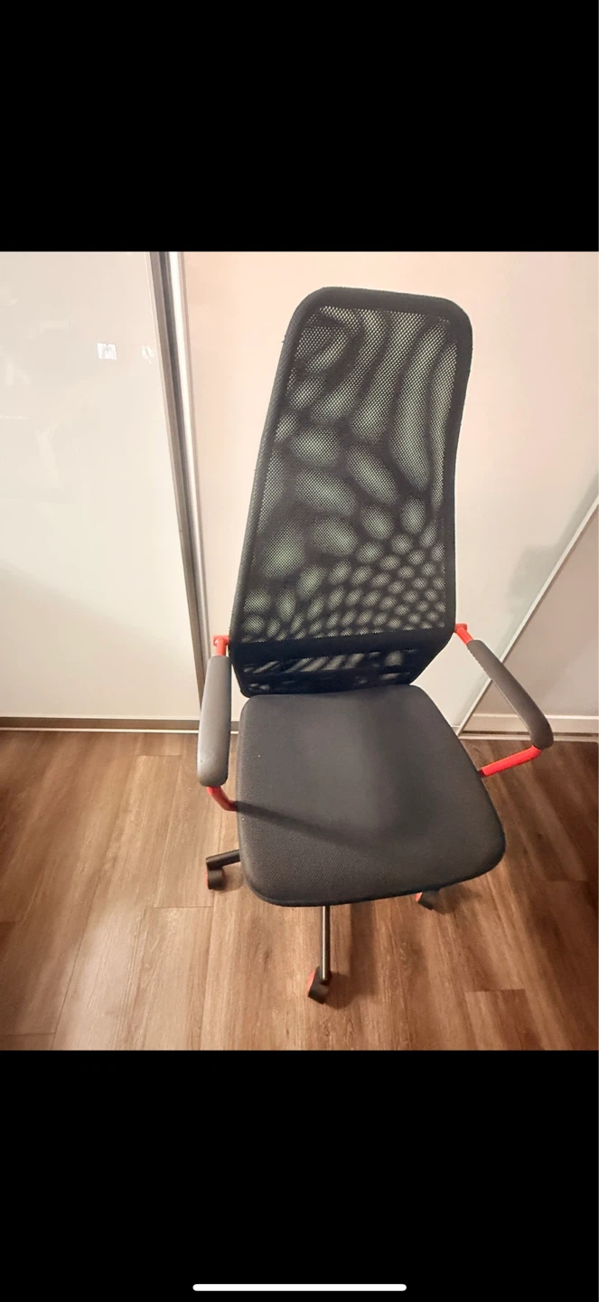 Mesh office chair with red accents