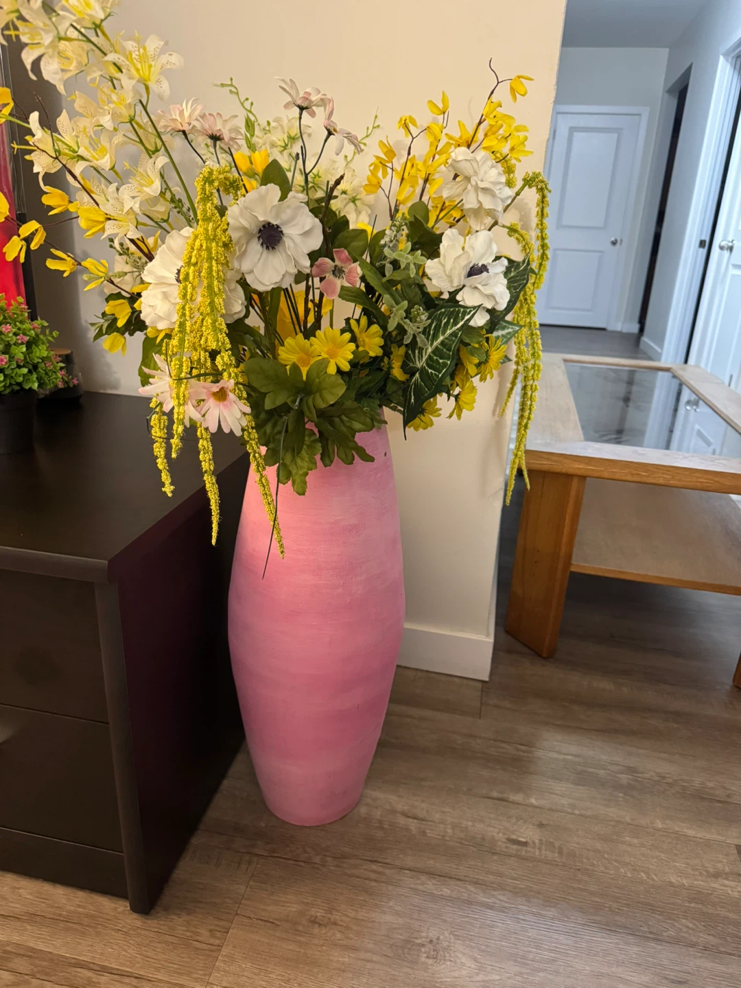 Large pink vase with artificial flowers
