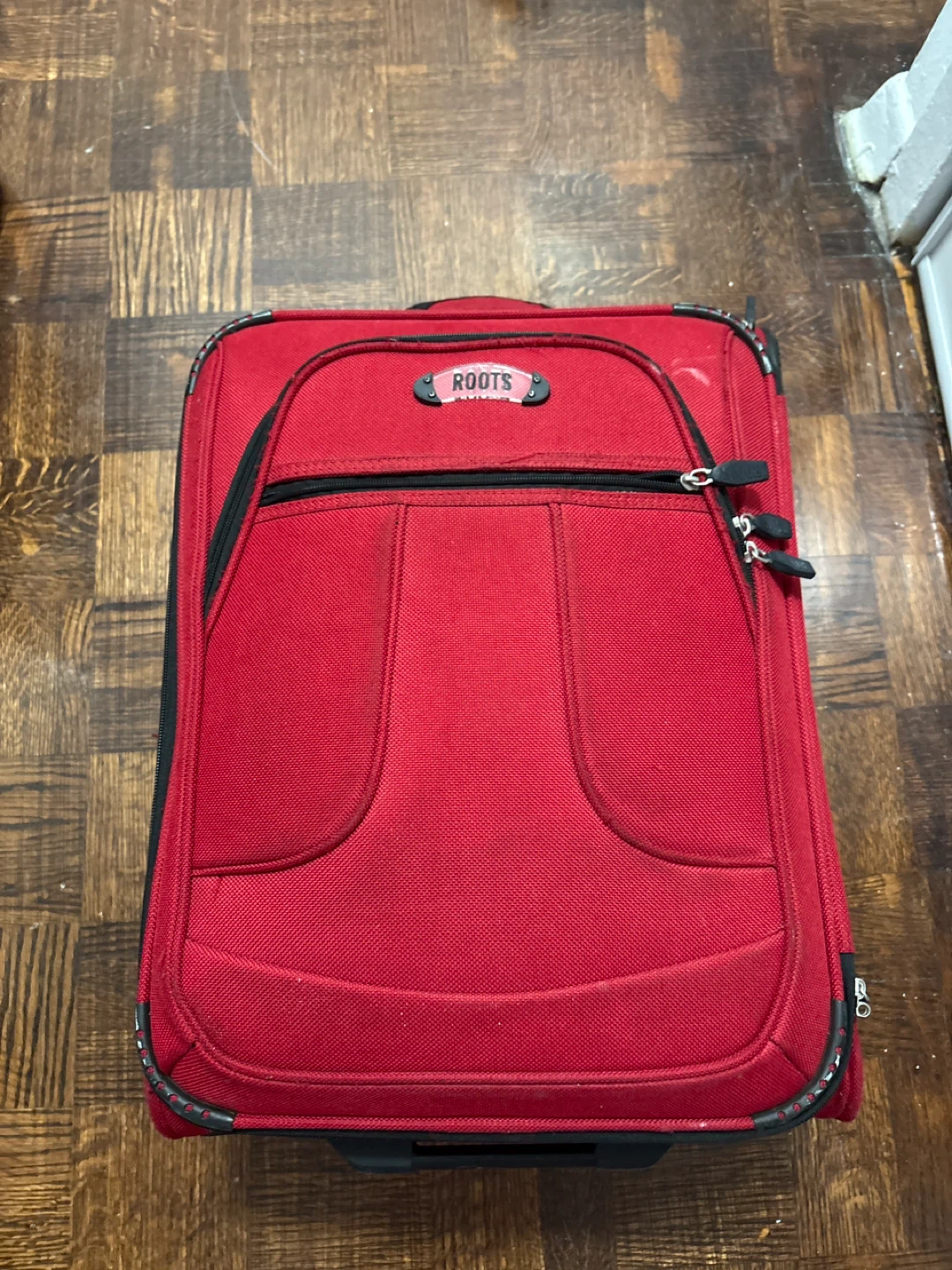 Roots Red Rolling Suitcase