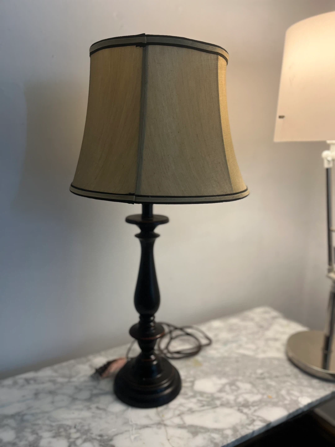 Bronze cast lamp with fluted linen shade
