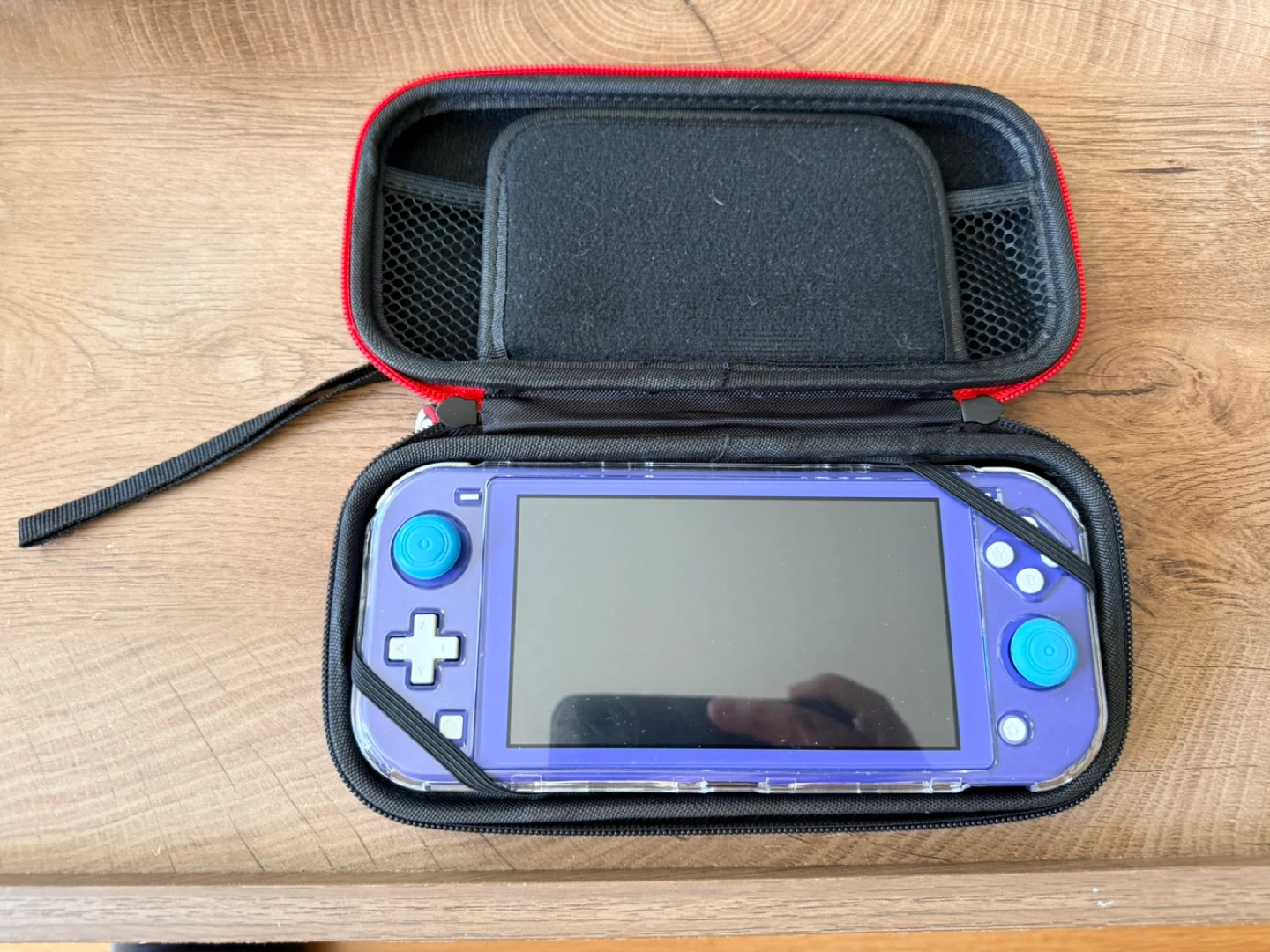 Nintendo Switch Lite with two Pokemon games