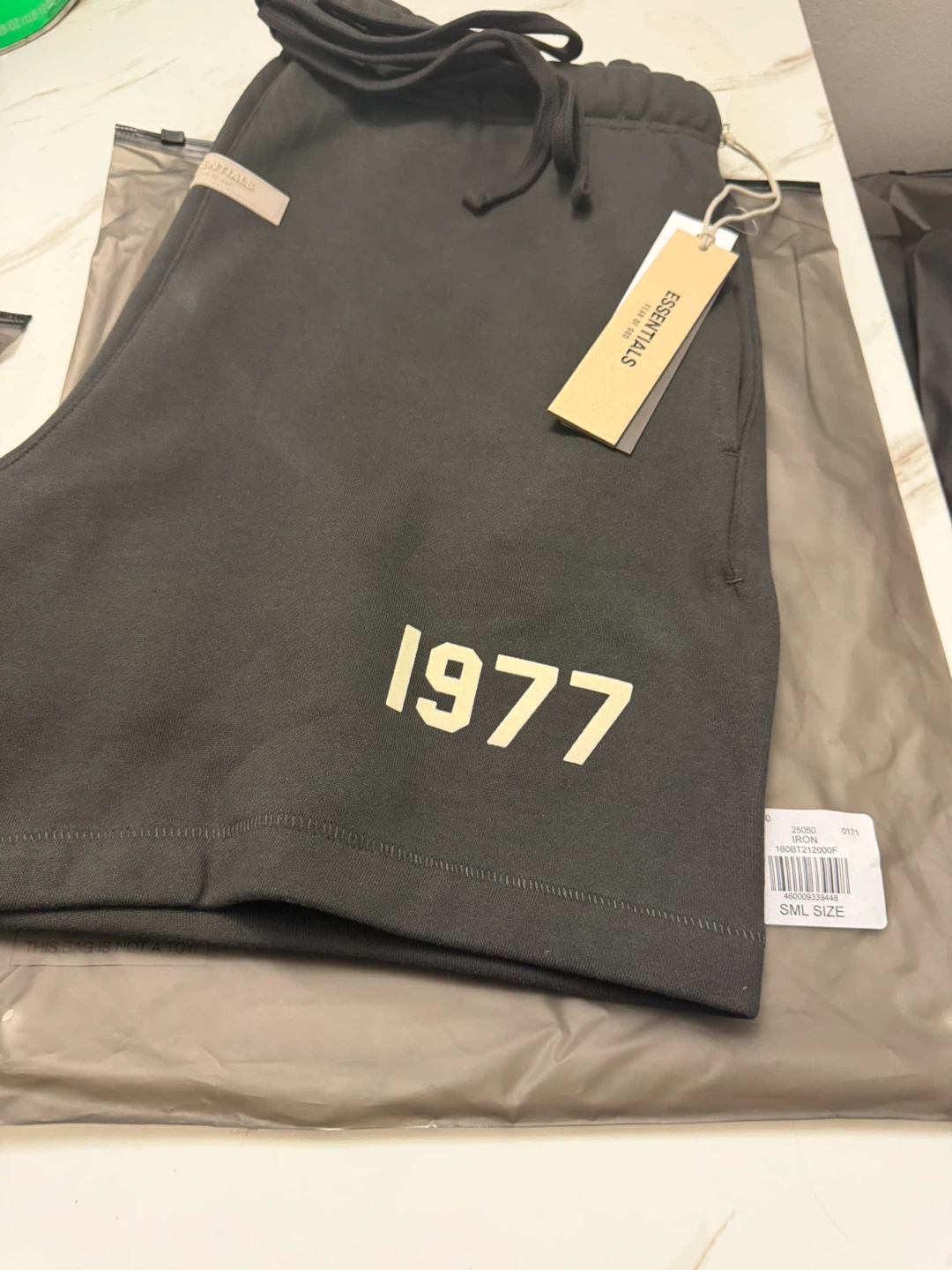 Essentials Men’s Iron Sweat Shorts with Cream '1977' Print