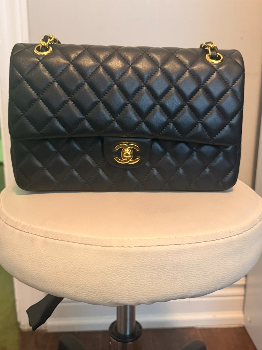 CHANEL Black Quilted Lambskin Classic Flap Handbag