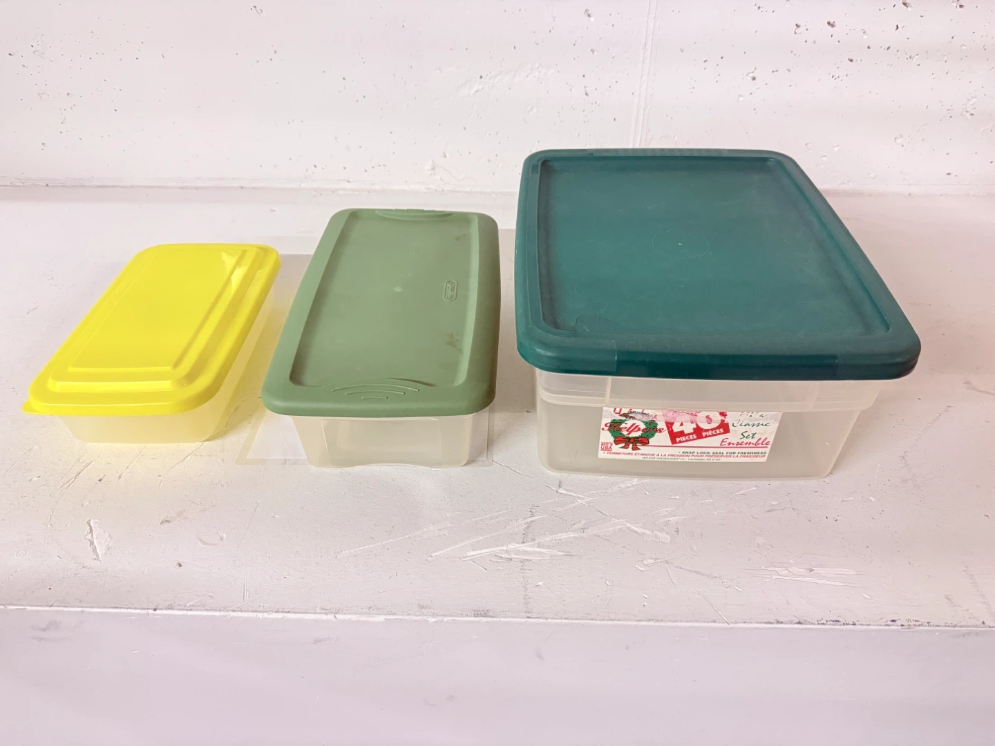 Three Plastic Storage Containers