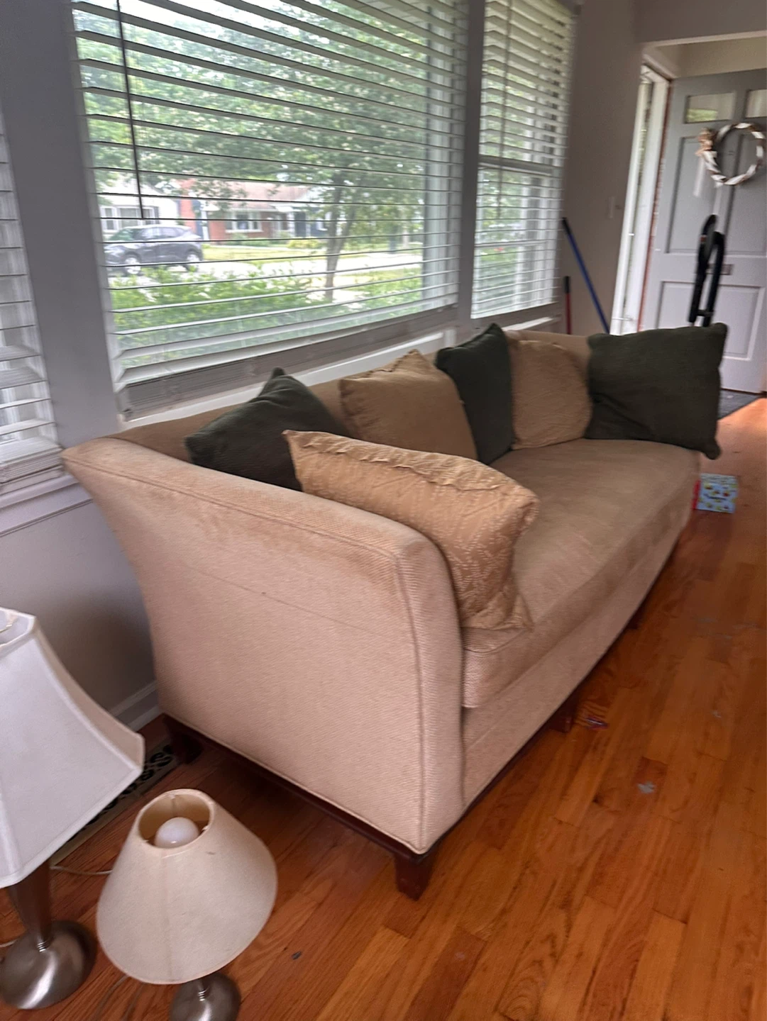 Tan Upholstered Sofa with Accent Pillows
