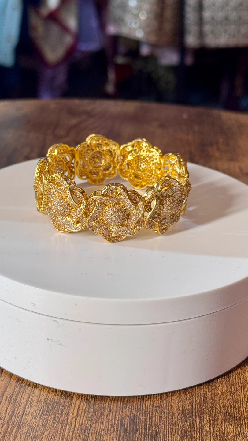 Gold-tone statement bracelet with crystal accents