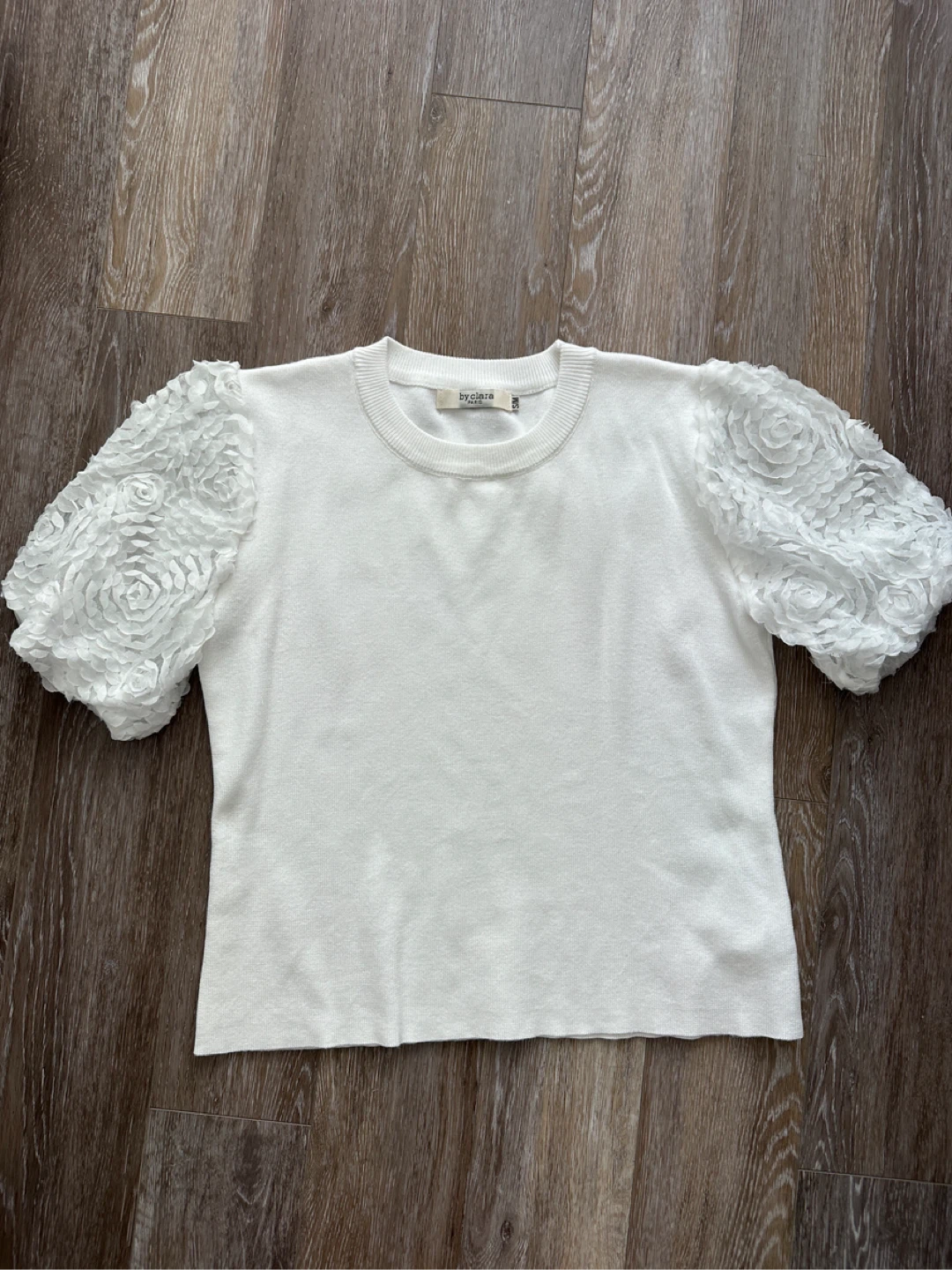 By Clara Paris white top with rose detail sleeves