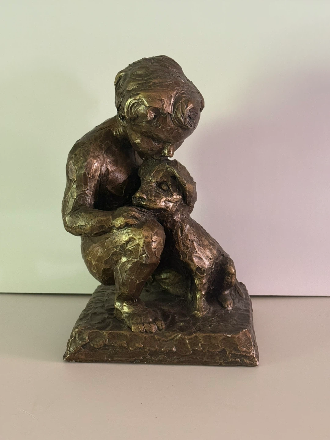 Statue of child with dog