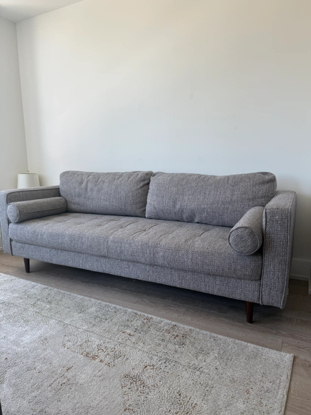Grey upholstered sofa