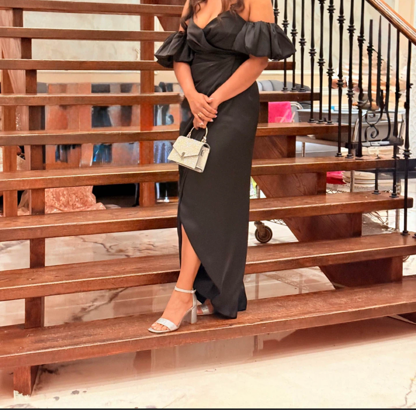 Black off-the-shoulder formal dress with ruffled sleeves