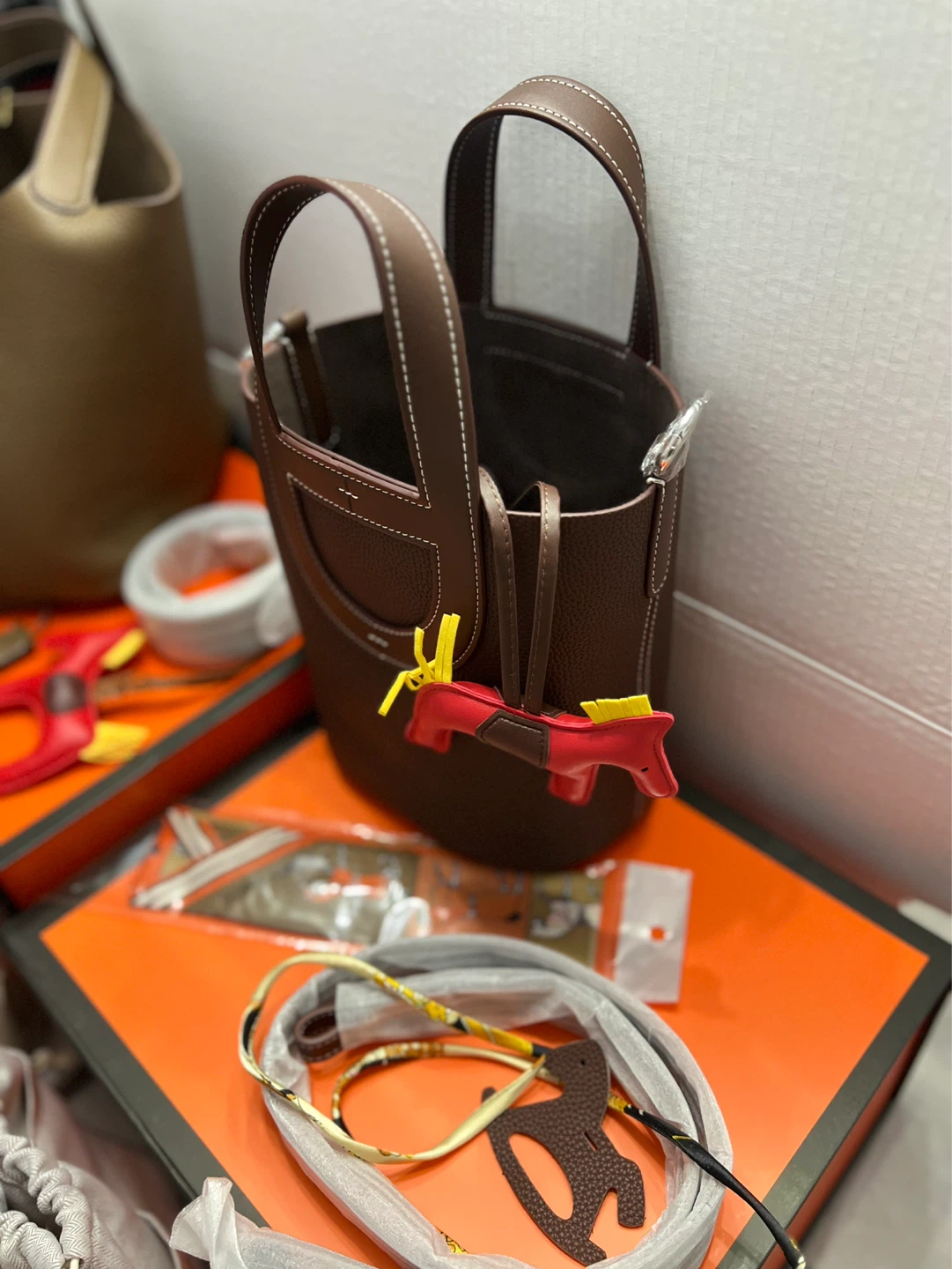 Hermès Brown Leather Bucket Bag with Charm