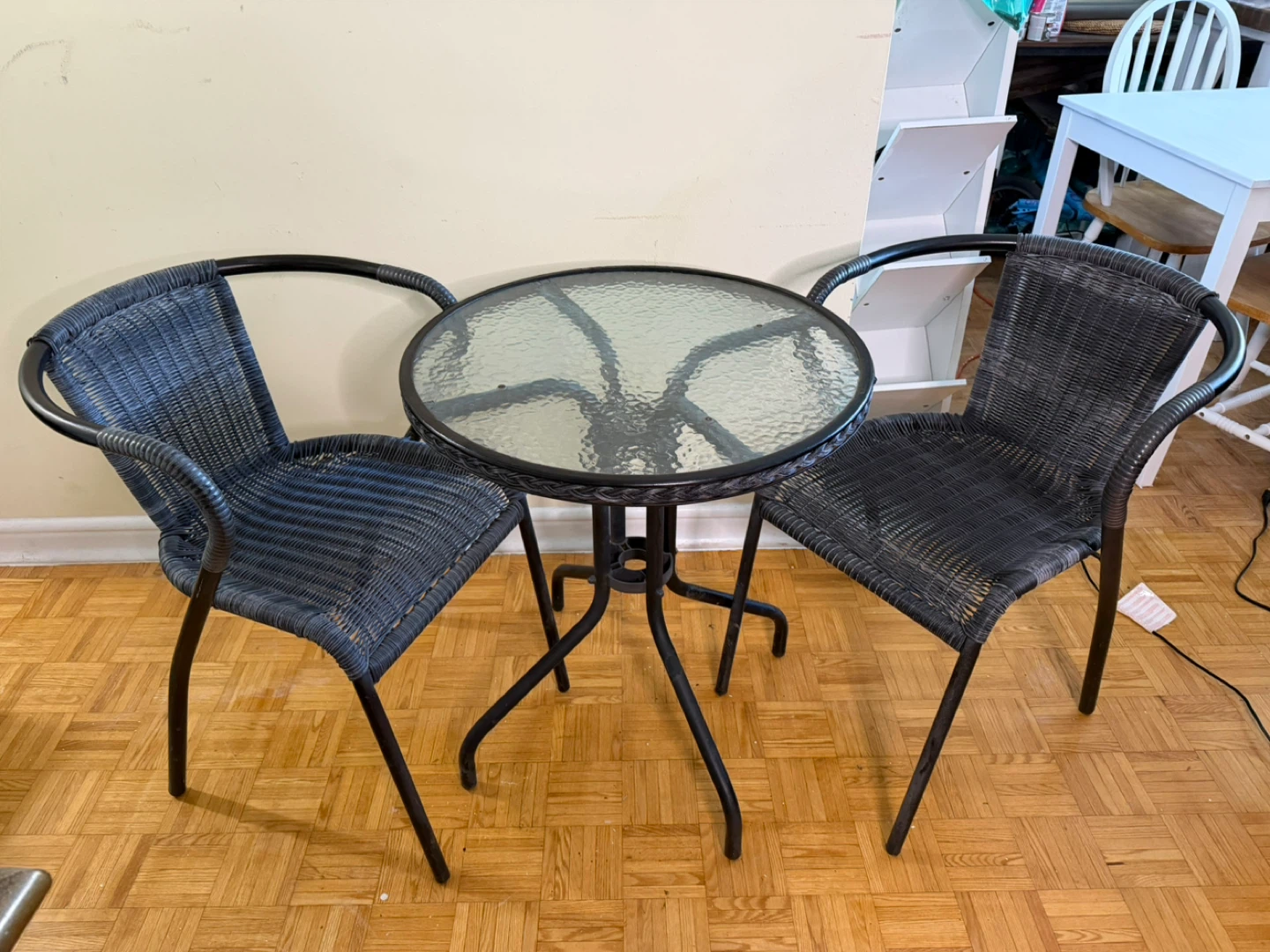Wicker patio bistro set with glass table