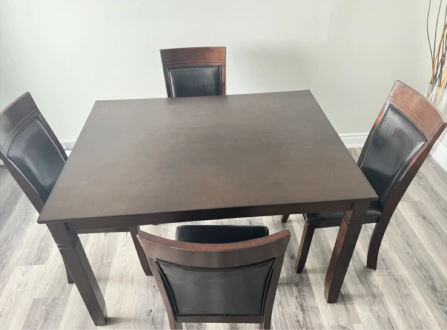 Dark Wood Dining Table with 4 Black Faux Leather Chairs