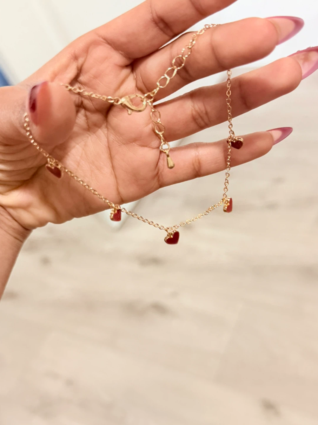 Gold-tone anklet with red heart charms
