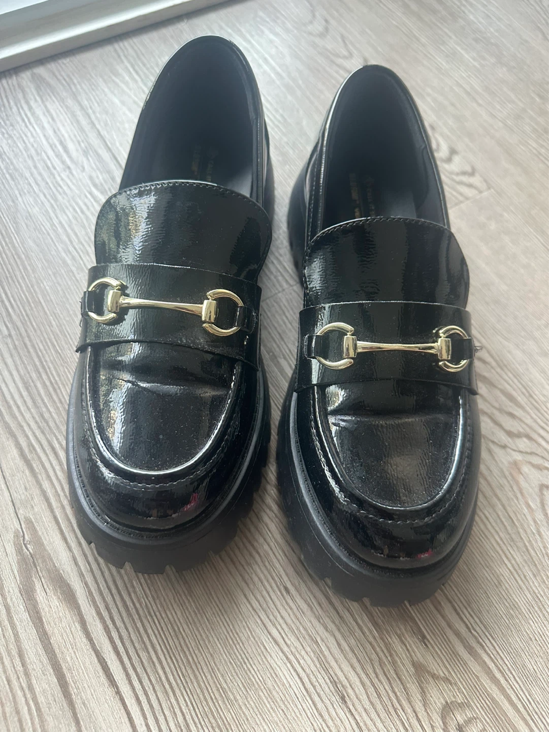 Call it Spring Black Loafers with Gold Buckle