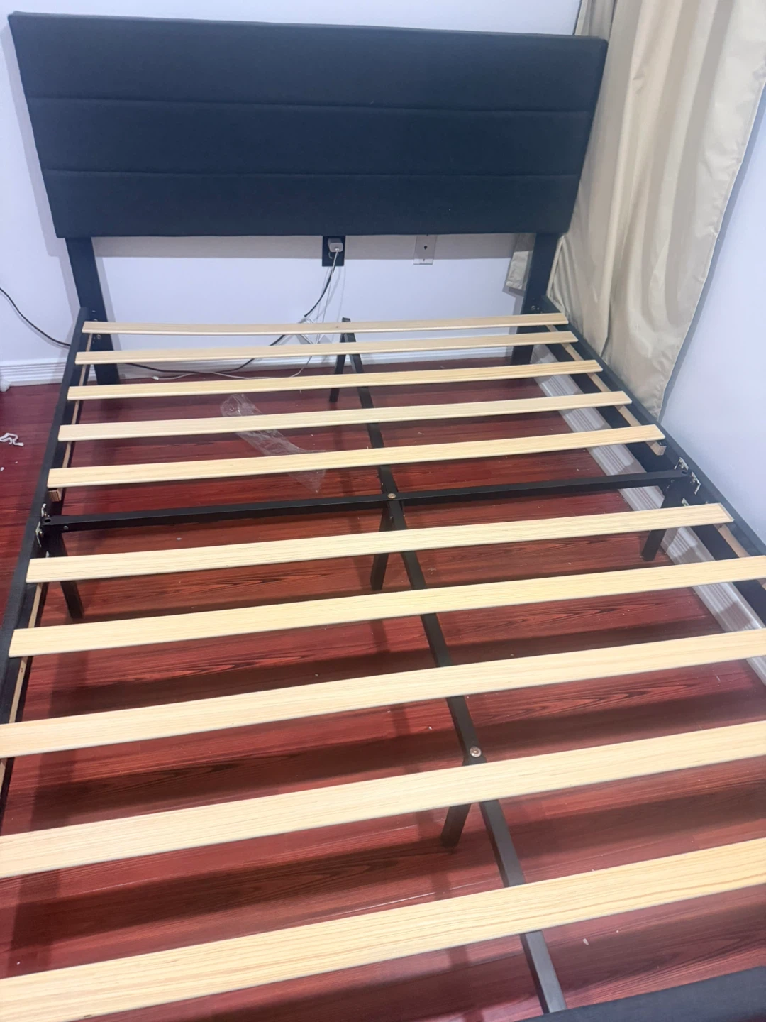 Black Upholstered Bed Frame with Wooden Slats
