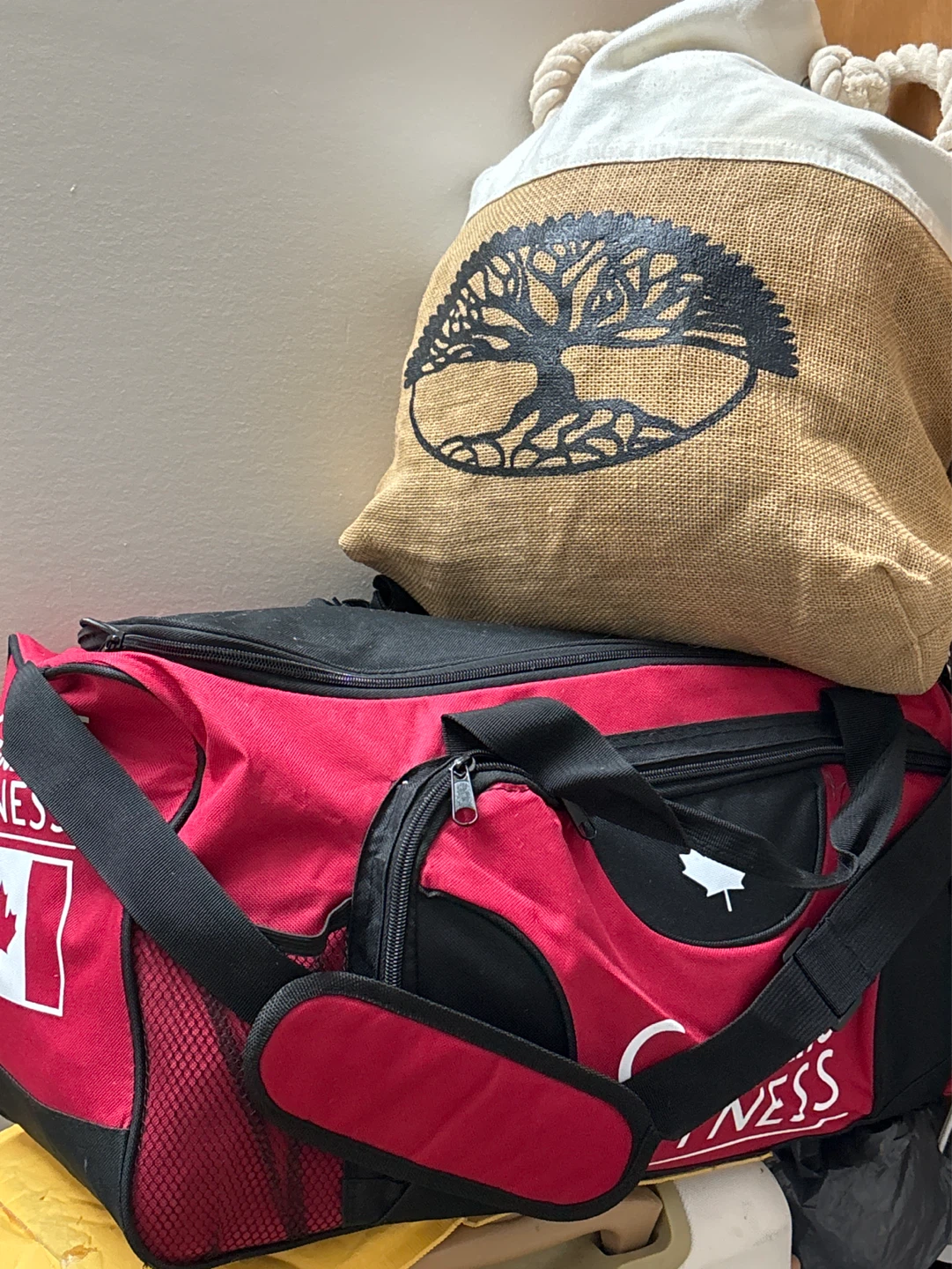 Red duffel bag with Canadian flag and maple leaf