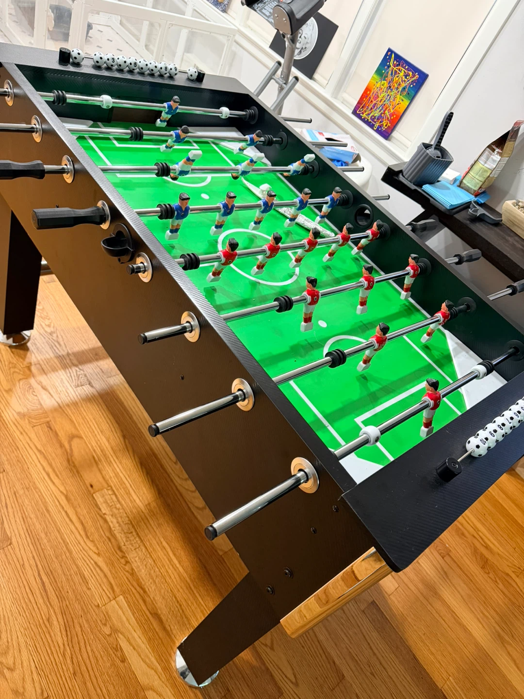 Black Foosball Table with Green Field