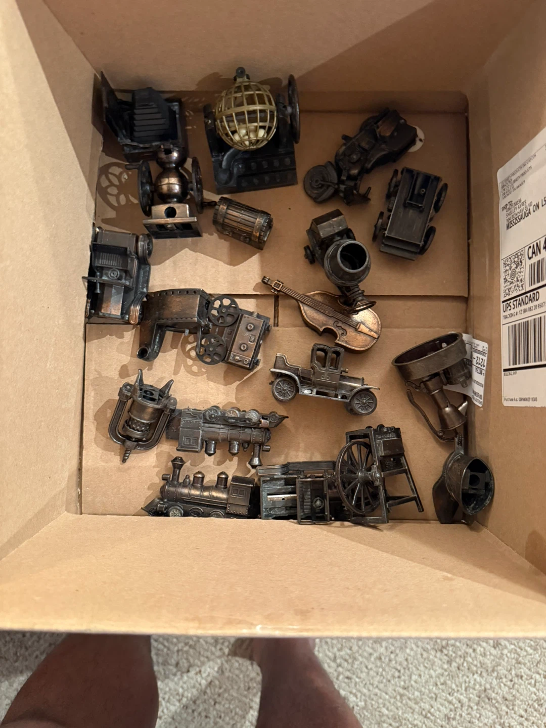 Assorted miniature metal vehicles and objects