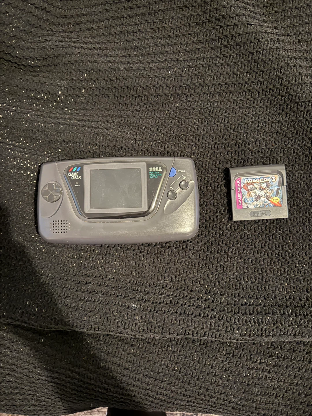 Sega Game Gear with Robocop 3 game cartridge