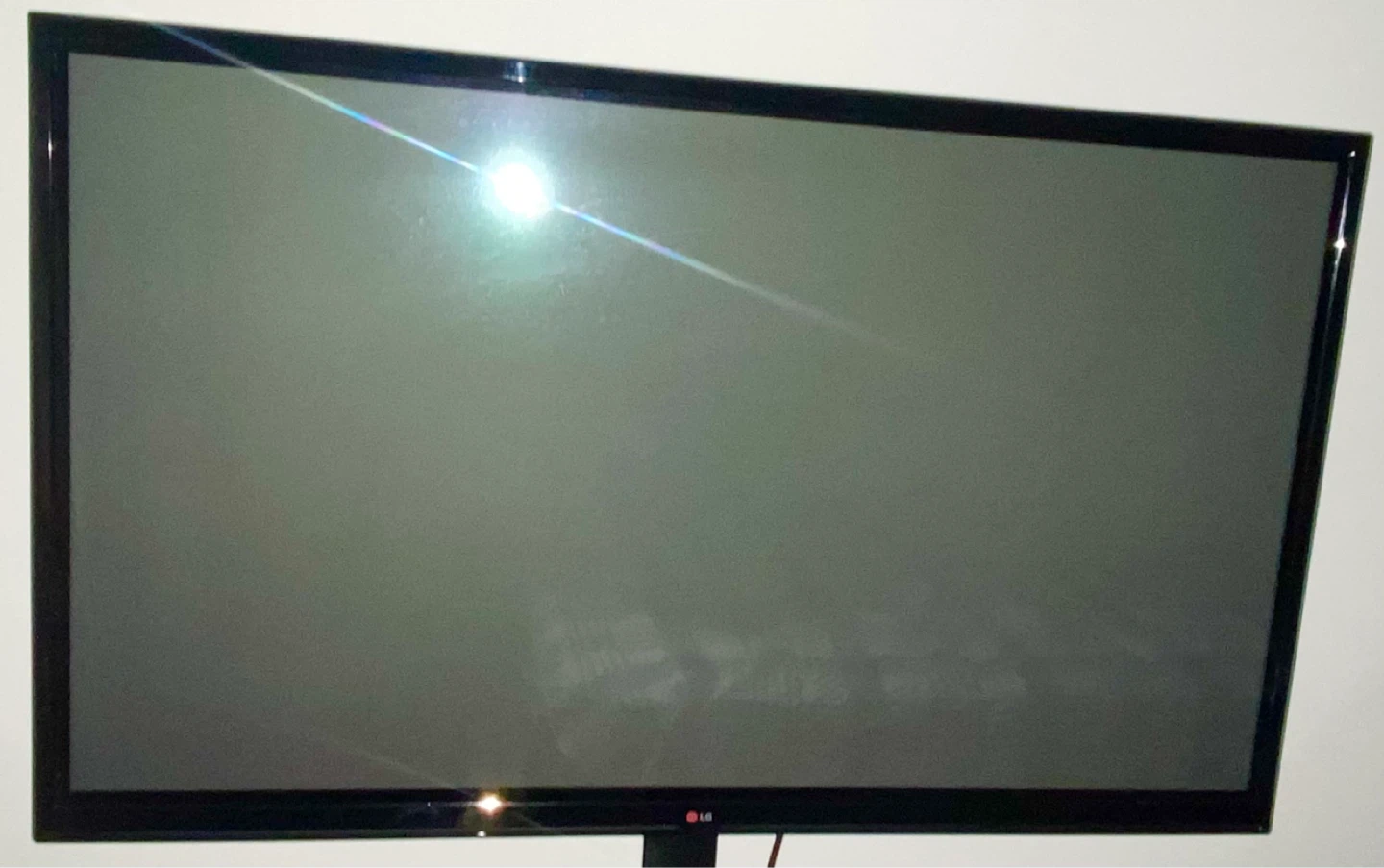LG Flat Screen TV with Black Glass Stand - photo 2