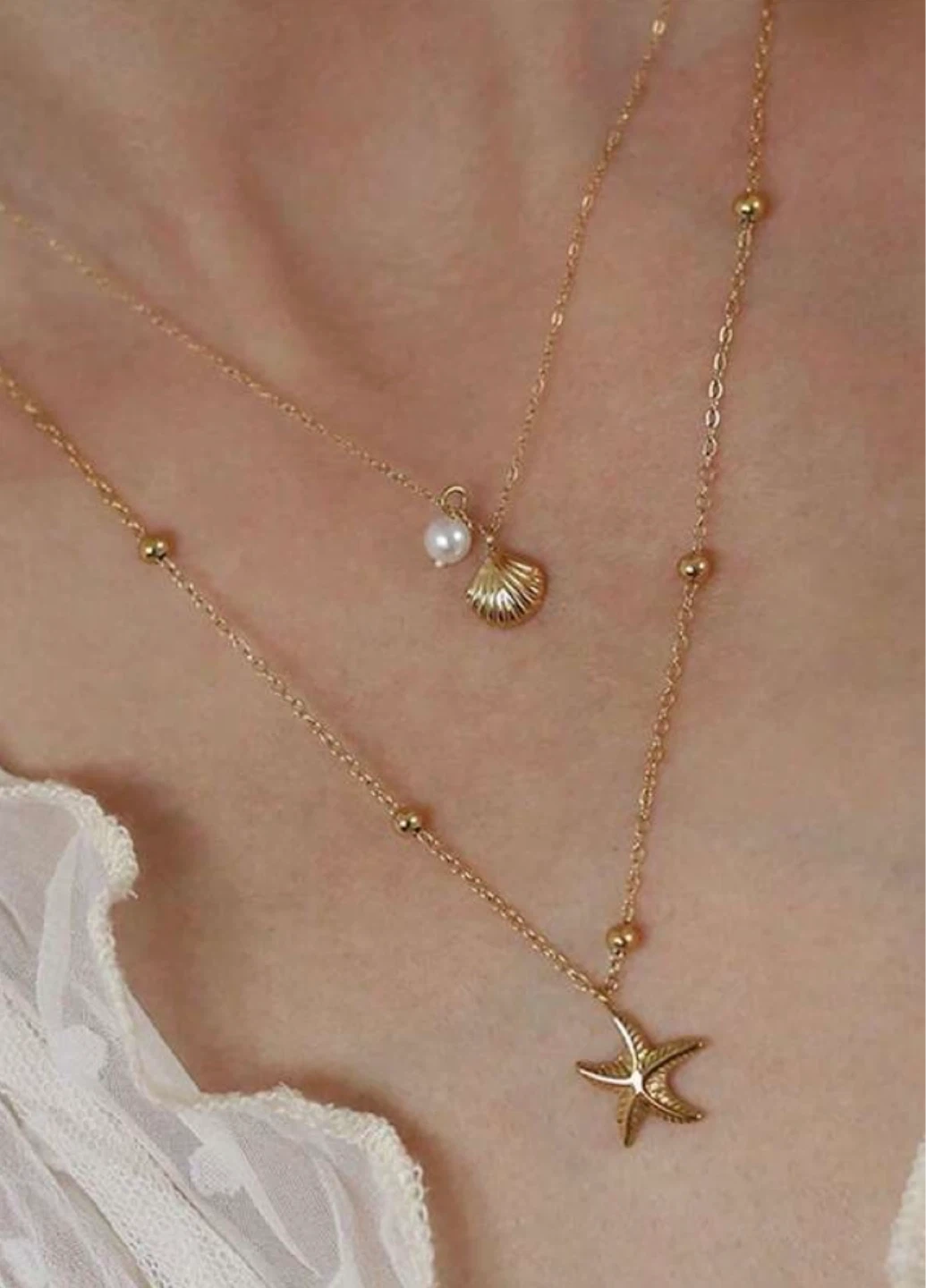 Gold Tone Layered Necklace with Starfish and Seashell Charms - photo 2