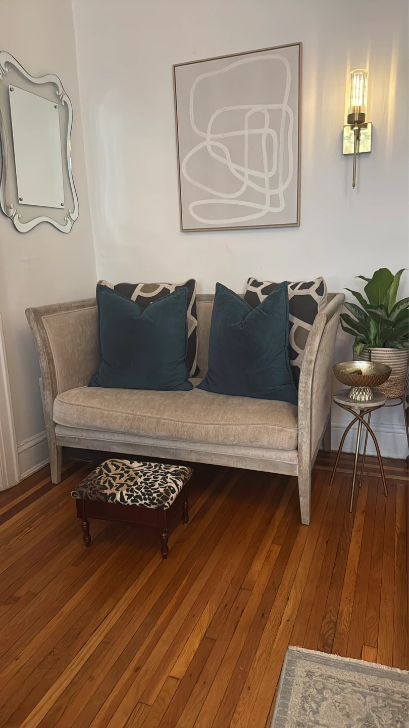 Cream Upholstered Loveseat with Curved Arms
