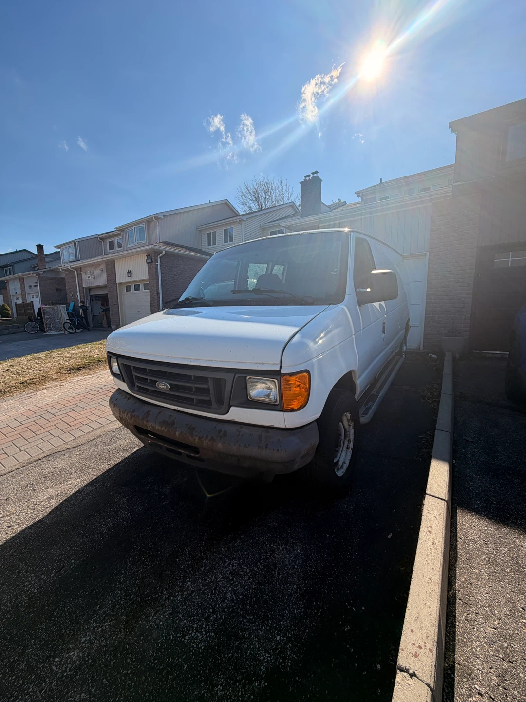 White Ford E-250 Van