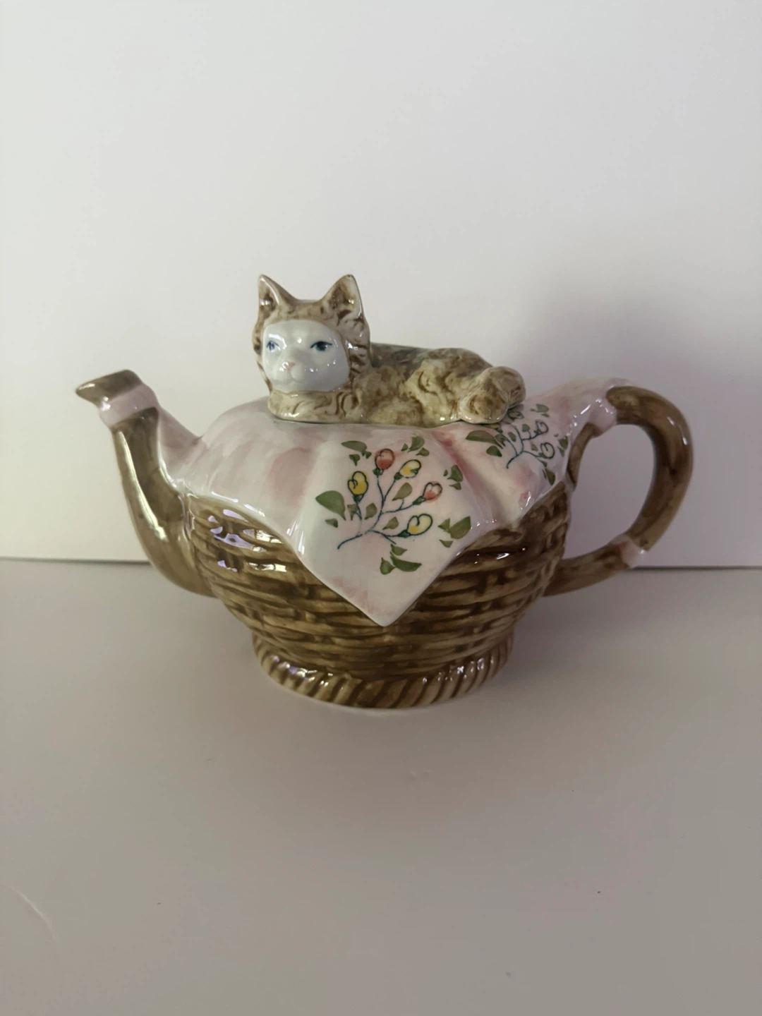 Cat on a basket teapot