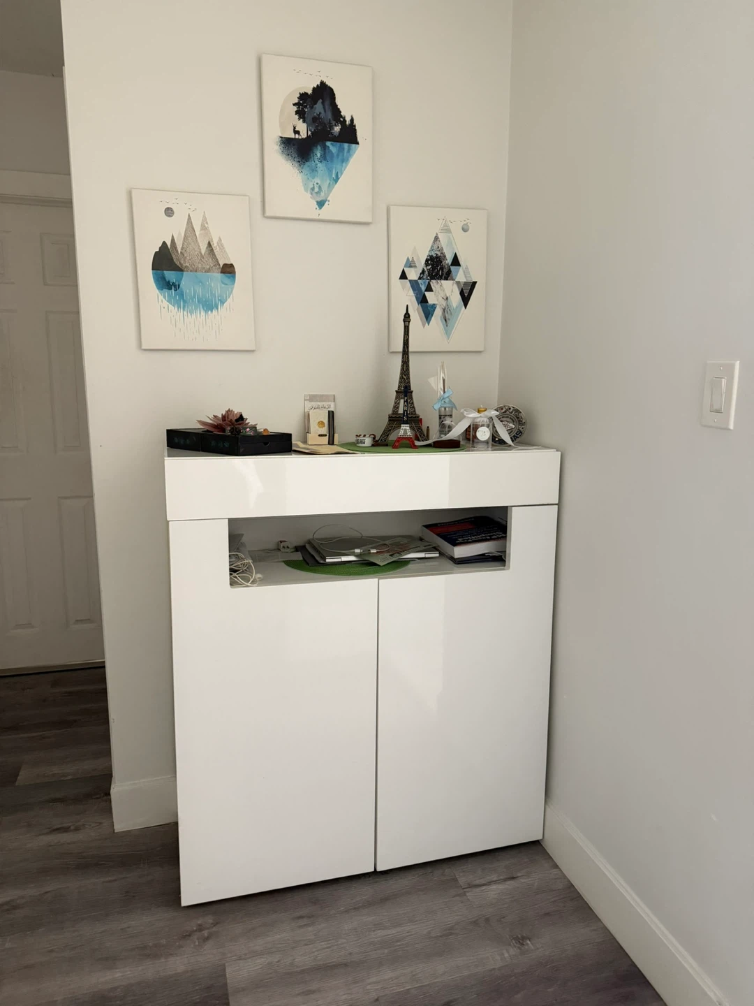 White two-door cabinet with shelf
