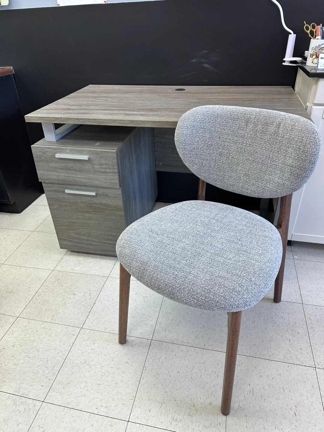 Grey wood grain office desk with drawers and Chair