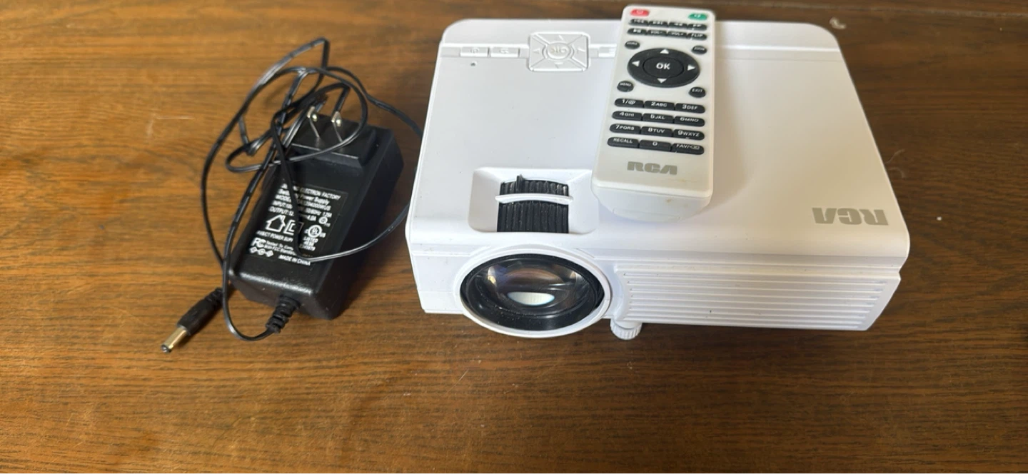 RCA Mini Projector with Remote and Power Adapter